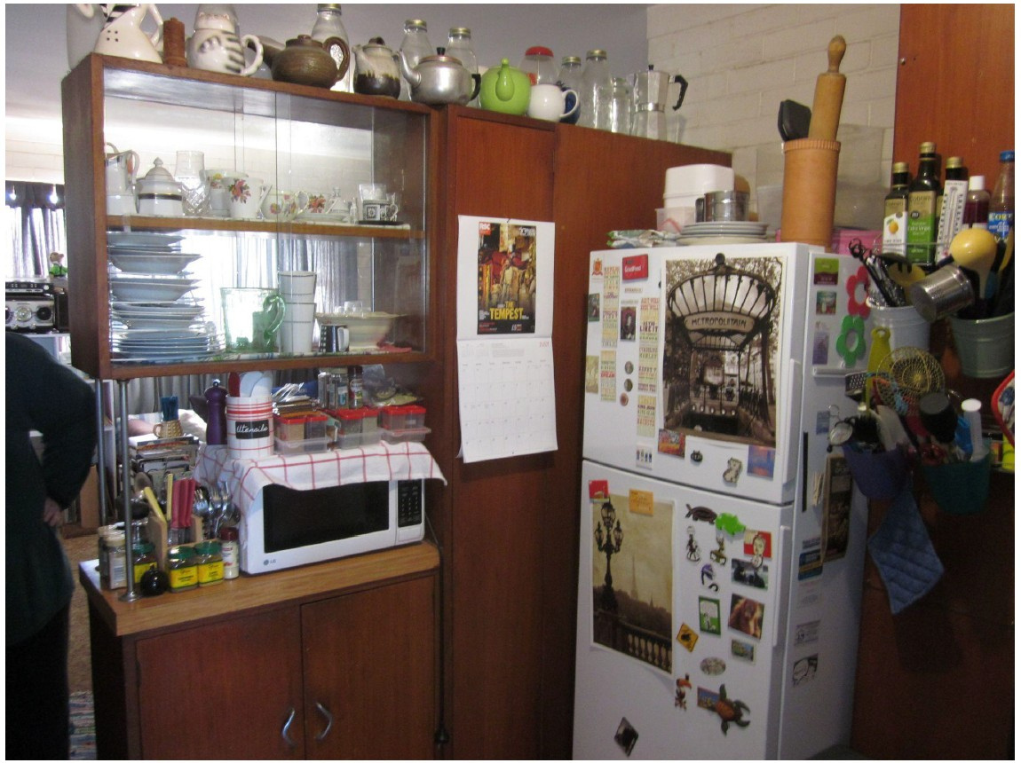Original cluttered kitchen in the Como unit